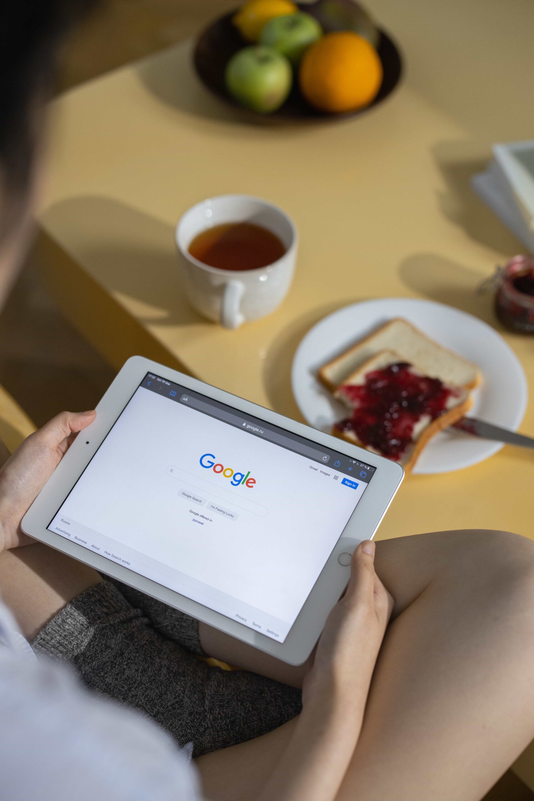 a person holding a tablet on a Google search