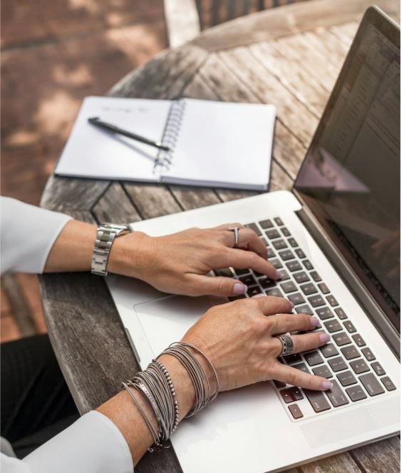 Woman using a laptop, symbolizing CRO tools.