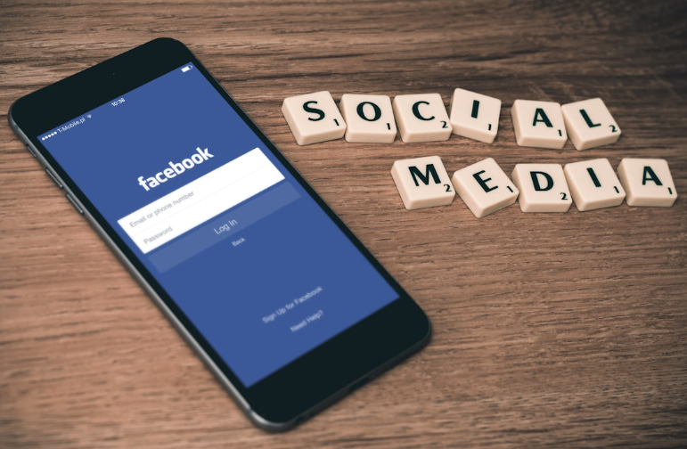 Smartphone with Facebook login screen representing tailored marketing strategies.