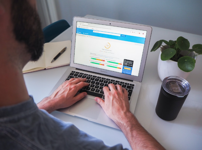 SEO expert analyzing website performance metrics on a laptop to adapt to AI-driven search changes.