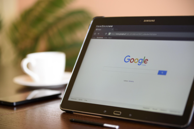 Tablet displaying Google homepage, representing AI PPC analysis tools.