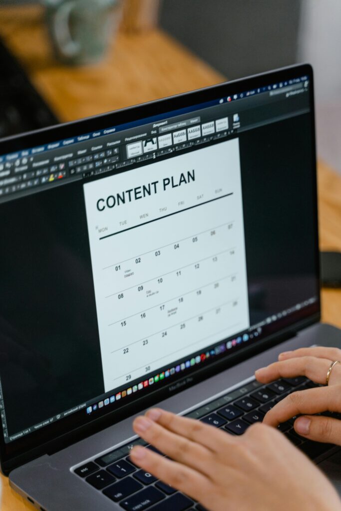Laptop screen displaying a content plan calendar for SEO strategy.