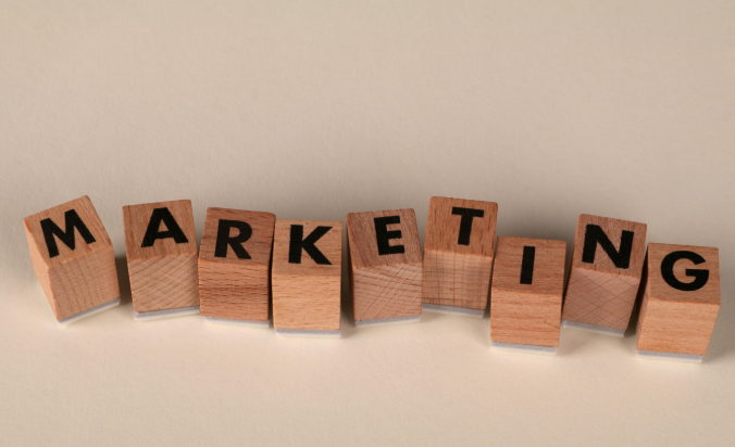 Wooden blocks spelling “marketing” symbolizing adaptation to modern digital marketing trends.
