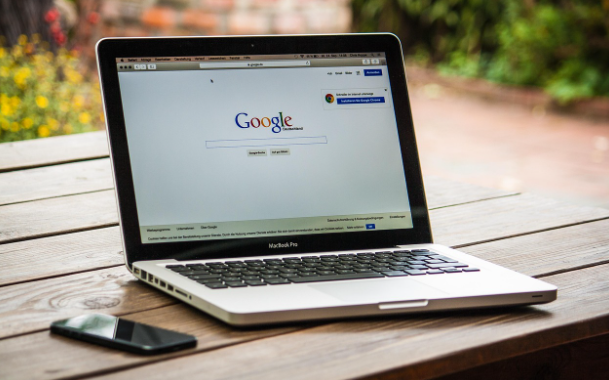 Laptop with Google search page open, symbolizing website content optimization strategies
