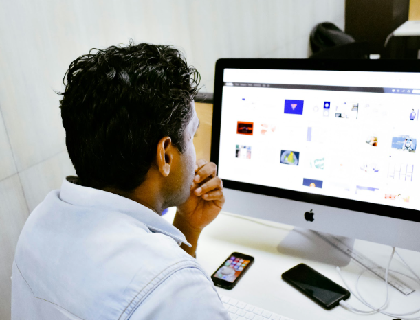 Person reviewing email content on a computer screen, illustrating strategies for improving engagement through stronger subject lines and personalized messaging.