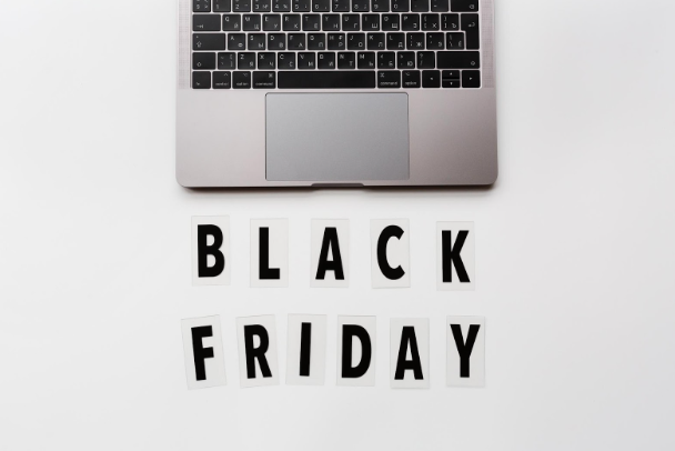 black friday text displayed below a laptop symbolizing digital marketing and social media advertising