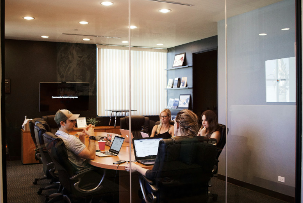 marketing team meeting to plan social media advertising strategy for black friday promotions