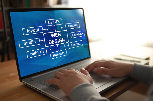 Laptop screen displaying web design and UI/UX elements, representing the process of designing a professional website