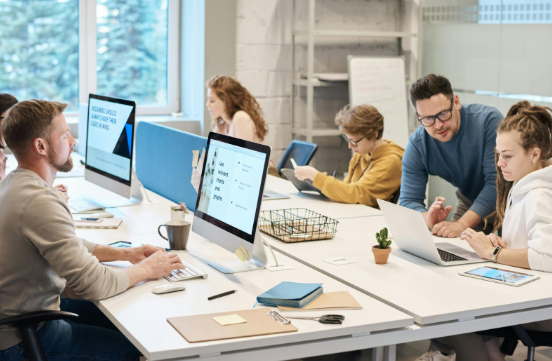 Marketing team analyzing paid media performance and ROI data in a collaborative workspace